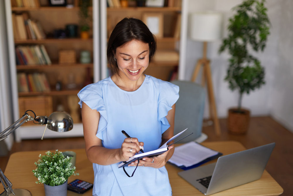 woman on her phone to contact rehab admissions